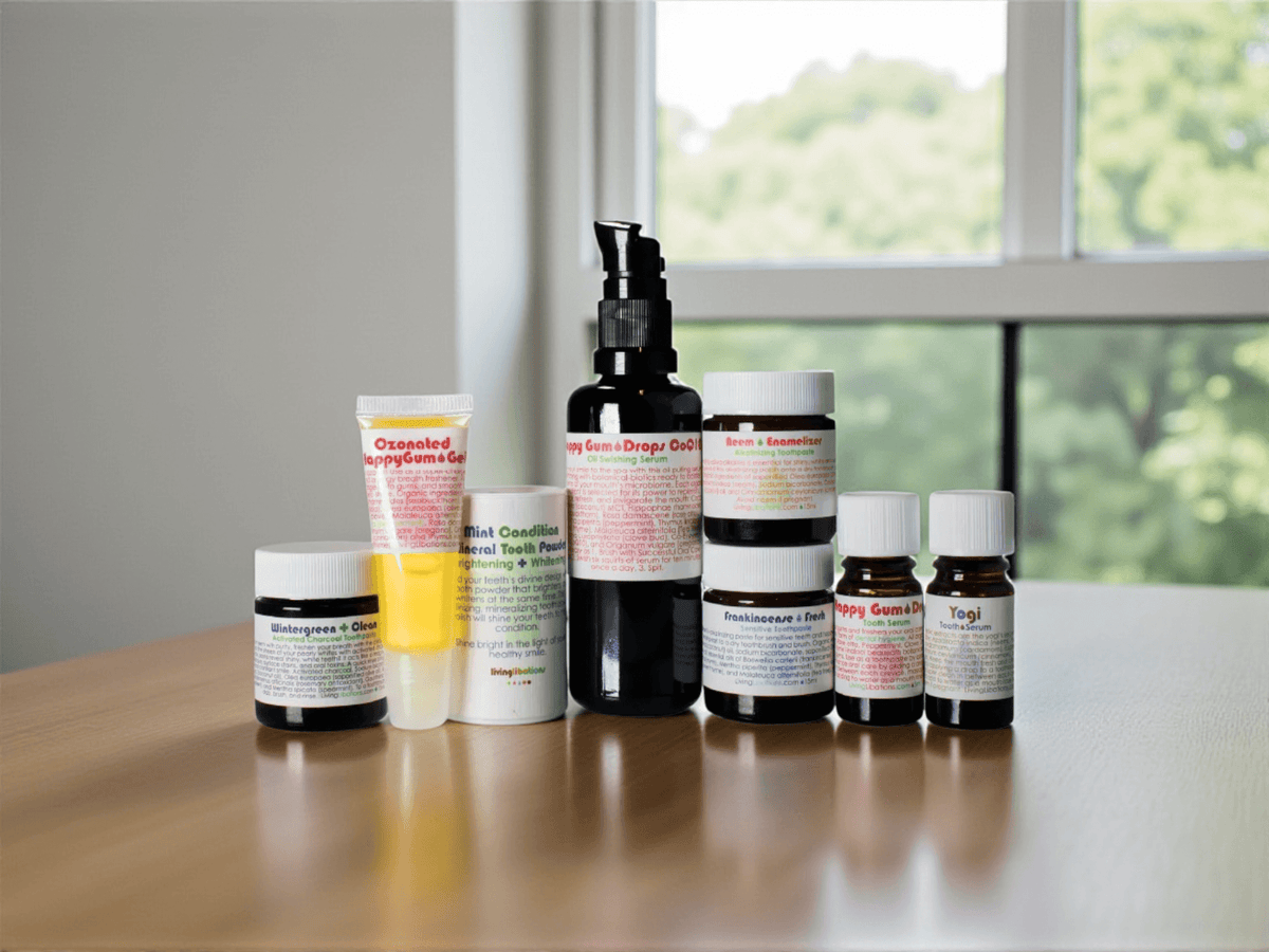 Various bottles of biotic oral care products for microbiome health arranged on a wooden table.