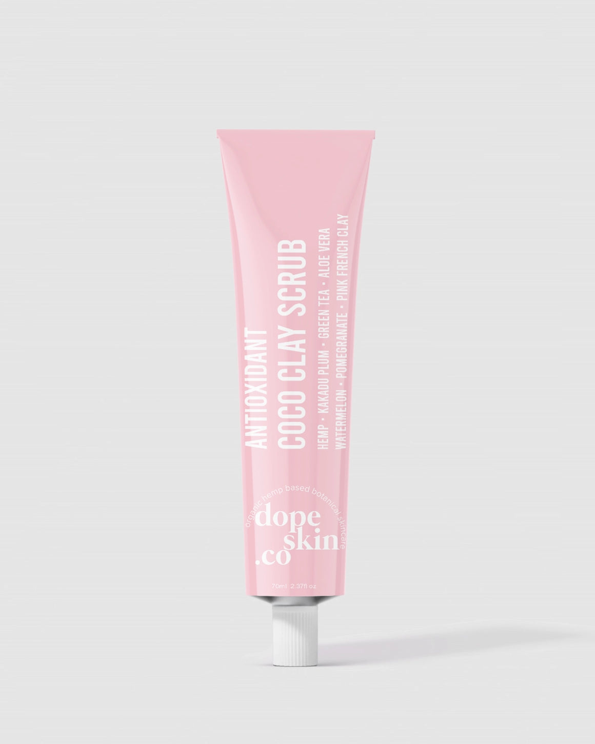 Pink tube of 'dope skin co' scrub on a white background