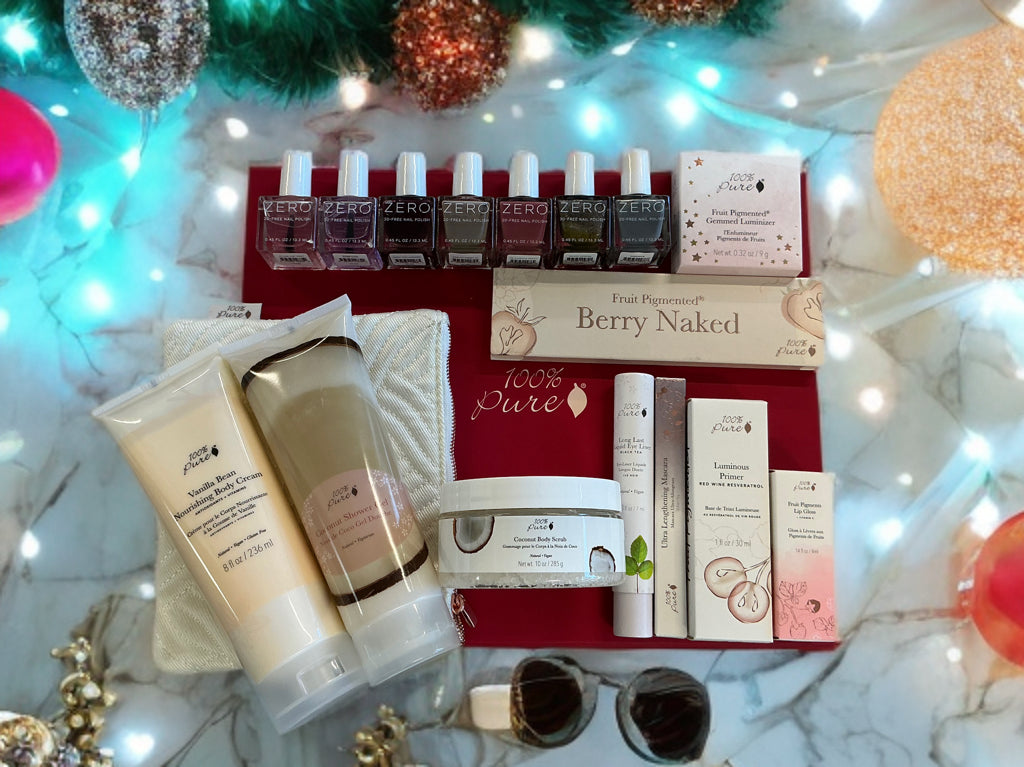 The ULTIMATE 100% Pure Party Box featuring cosmetics, nail polish, and body care products.