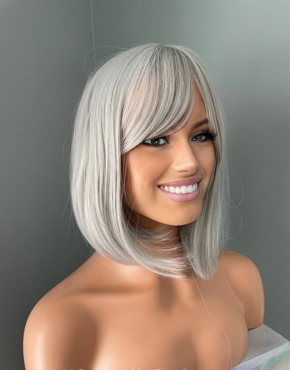 Yvette Short Silver Bob Wig showcasing a chic silver bob hairstyle with soft side-swept bangs, perfect for elegance.