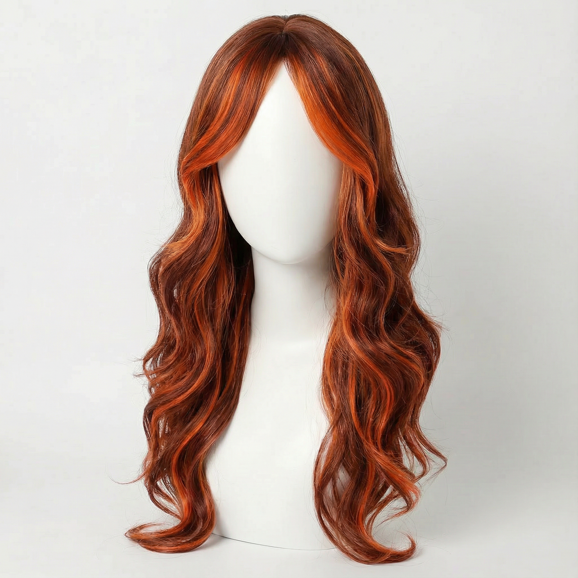 Maisie long black wig with orange highlights, showcasing wavy layers and vibrant orange color accents.