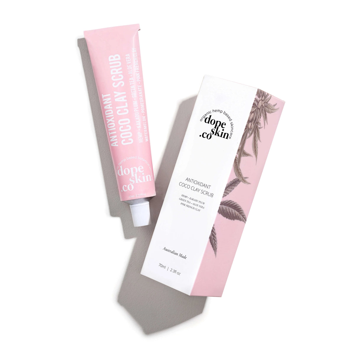 Two tubes of Dope Skin Co. Antioxidant Coco Clay Scrub on a white background