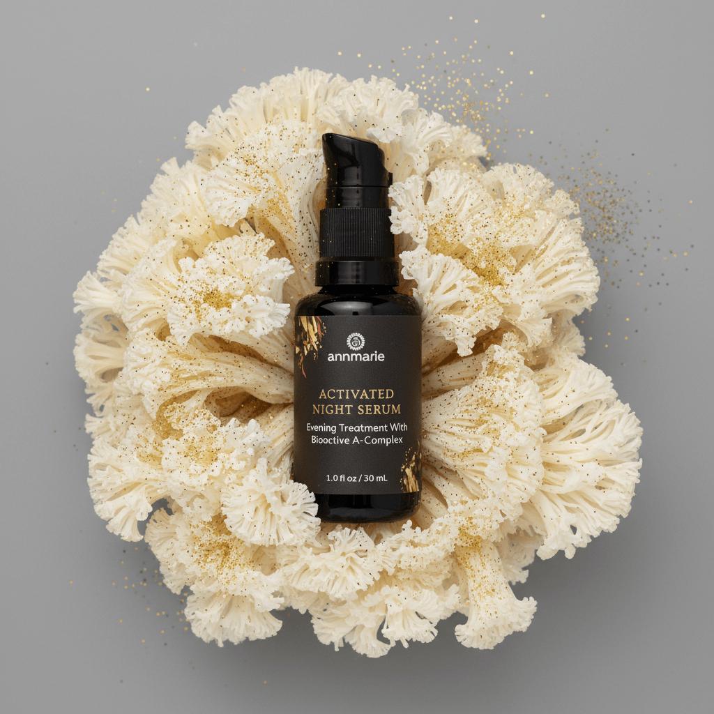 Amnaire Activated Night Serum bottle on a piece of white coral with a gray background