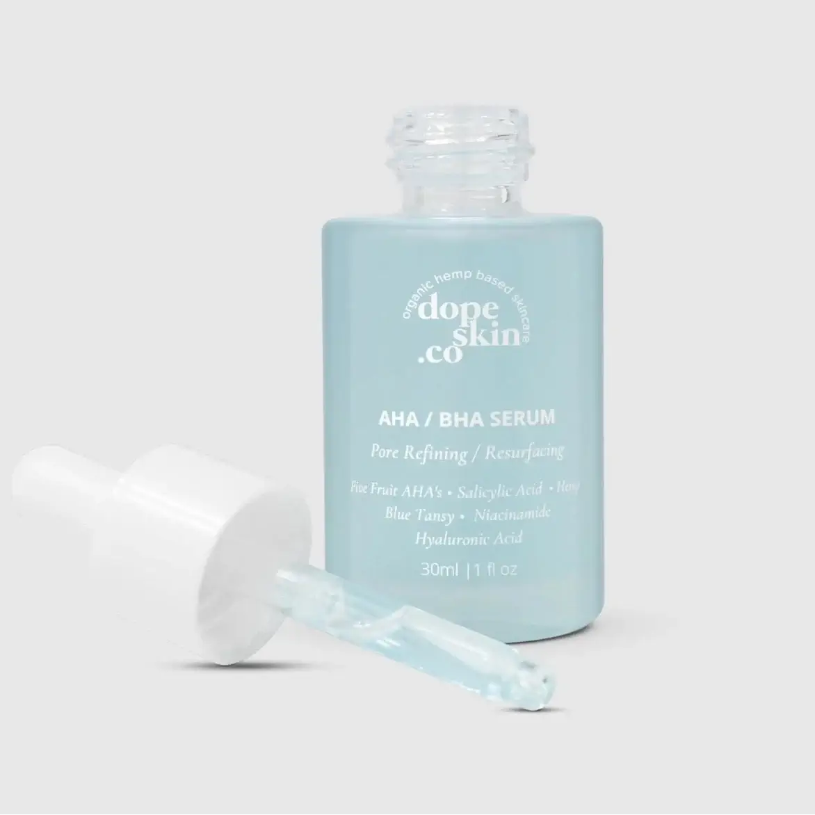 Dope Skin & Co. AHA/BHA serum bottle with applicator on a white background