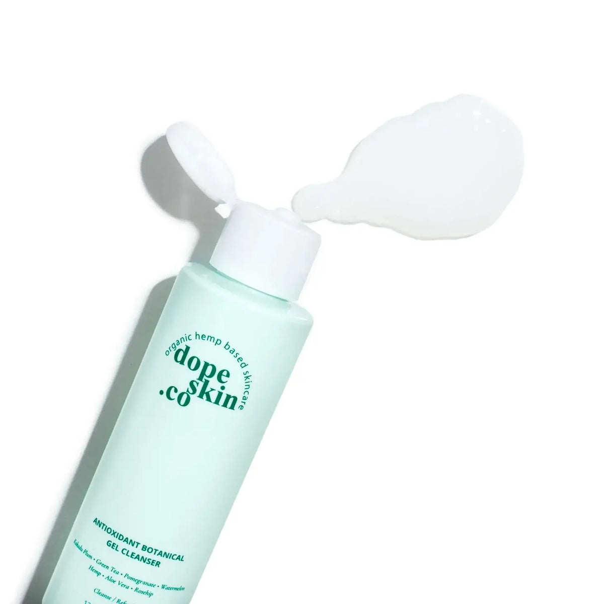 Skincare bottle with pump labeled 'dope skin co' on a white background