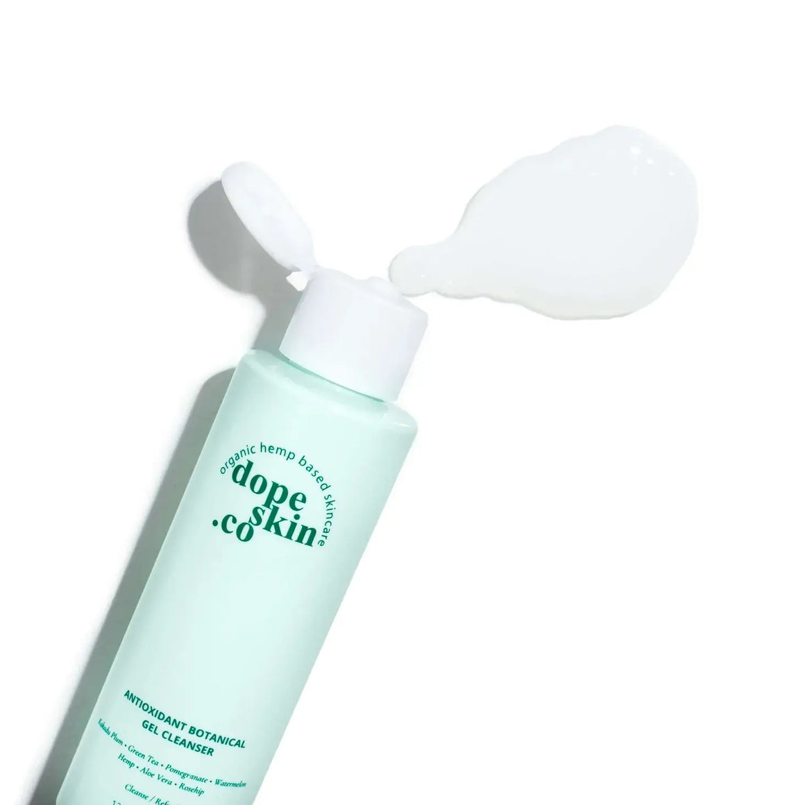 Skincare bottle with pump labeled 'dope skin co' on a white background
