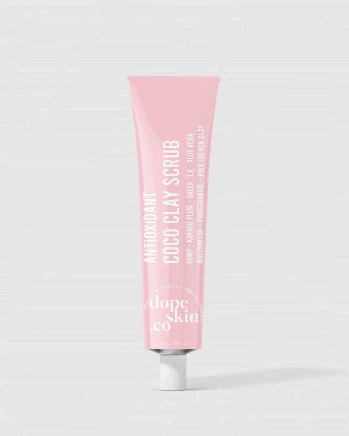Pink tube of 'dope skin co' scrub on a white background
