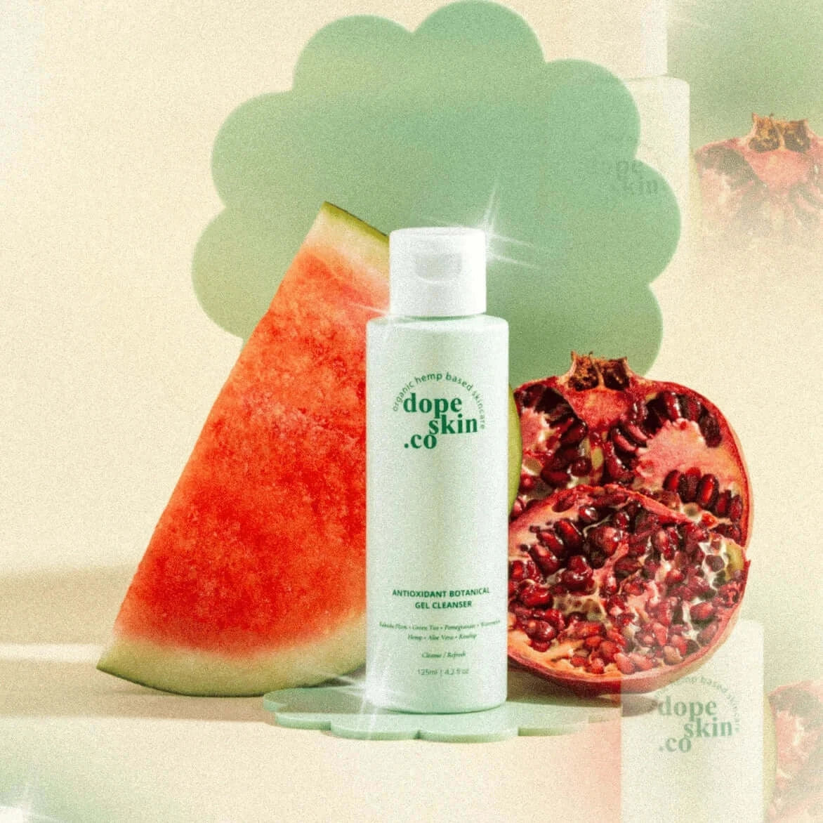 Skincare bottle labeled 'dope skin co' with watermelon and pomegranate on a light background