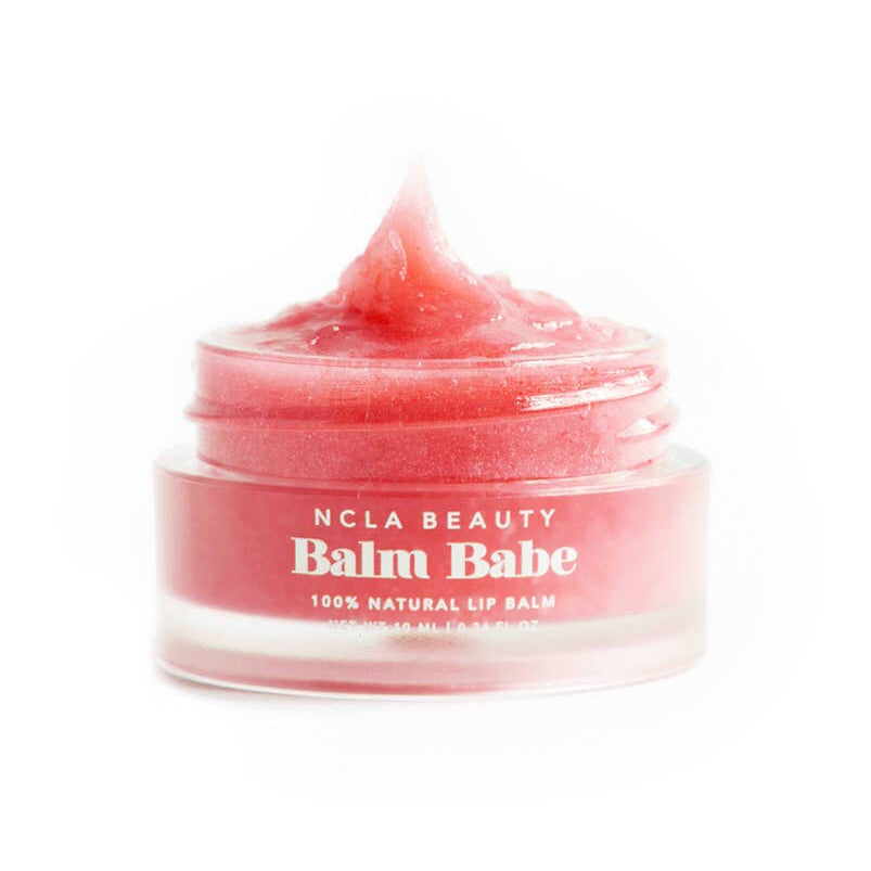 Pink lip balm jar labeled 'Balm Babe' by NCLA Beauty on a white background