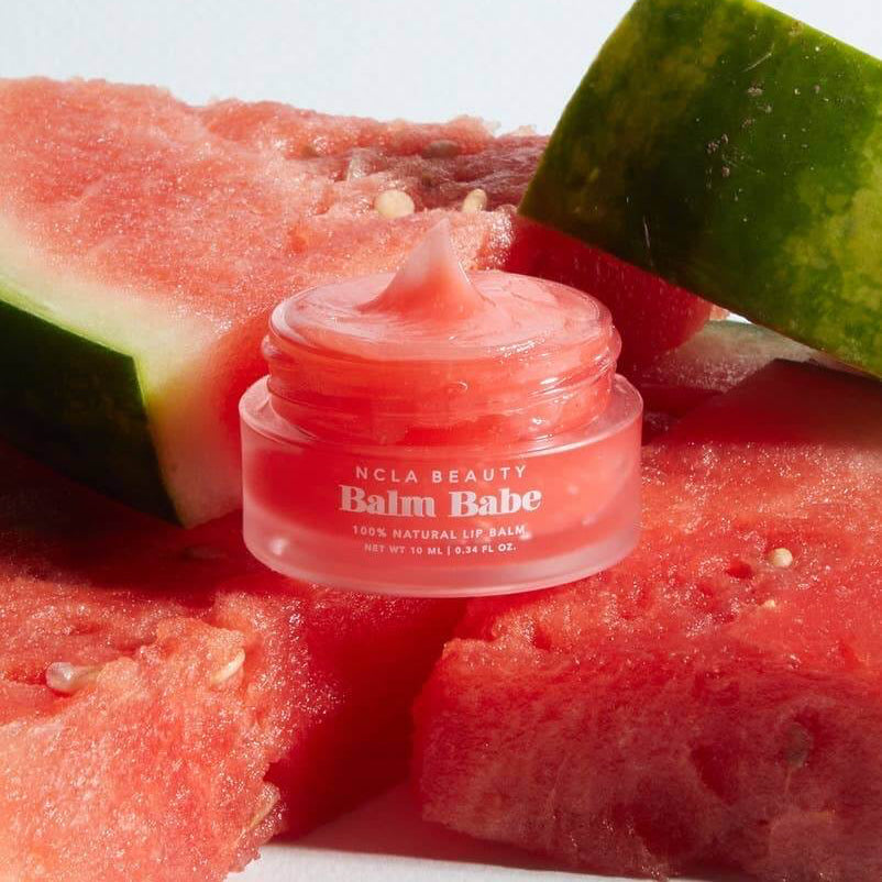 Balm Babe jar with watermelon slices on a white background