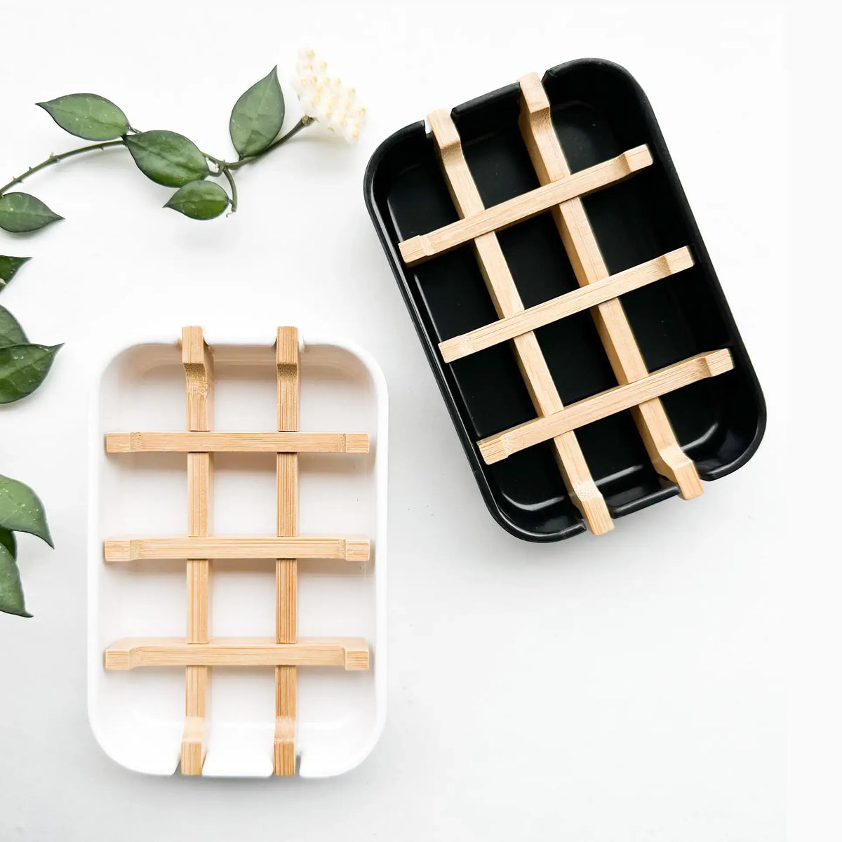 Two rectangular trays with wooden lattice designs on a white background