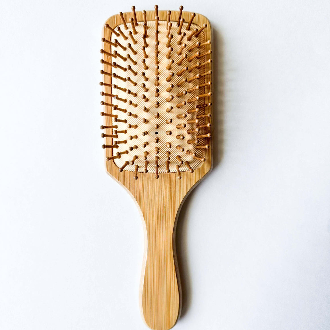 Bamboo Hair Brush designed to reduce static and combat frizz for all hair types.