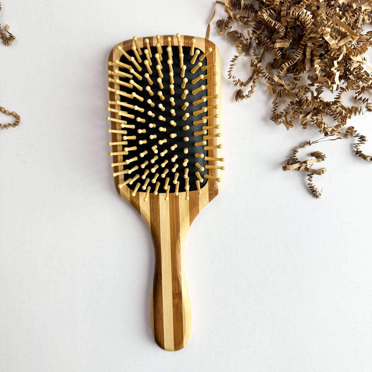 Bamboo Hair Brush - Smile Boutiques featuring wooden bristles for gentle detangling and scalp stimulation.