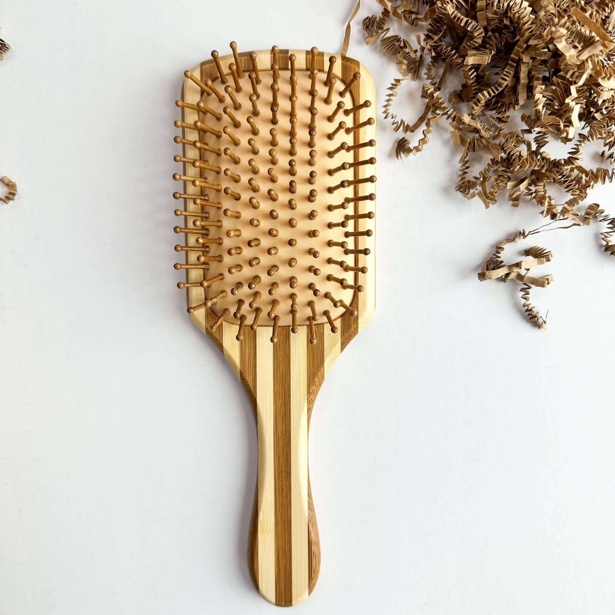 Bamboo Hair Brush - Smile Boutiques with natural wooden bristles for gentle detangling and scalp stimulation.