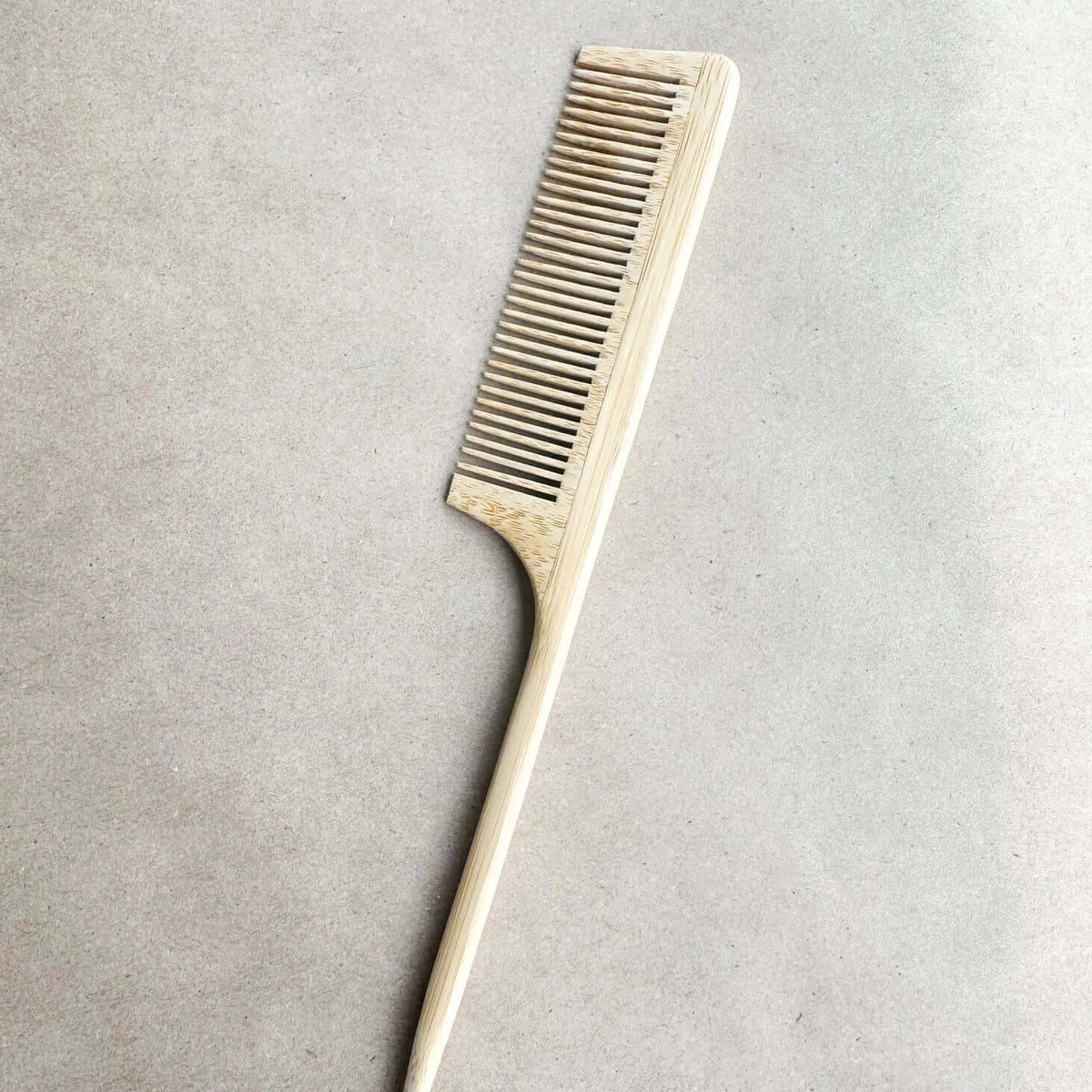 Metallic comb on a gray background