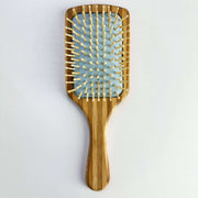 Bamboo Paddle Hair brush - Smile Boutiques with smooth bristles for gentle, sustainable haircare.