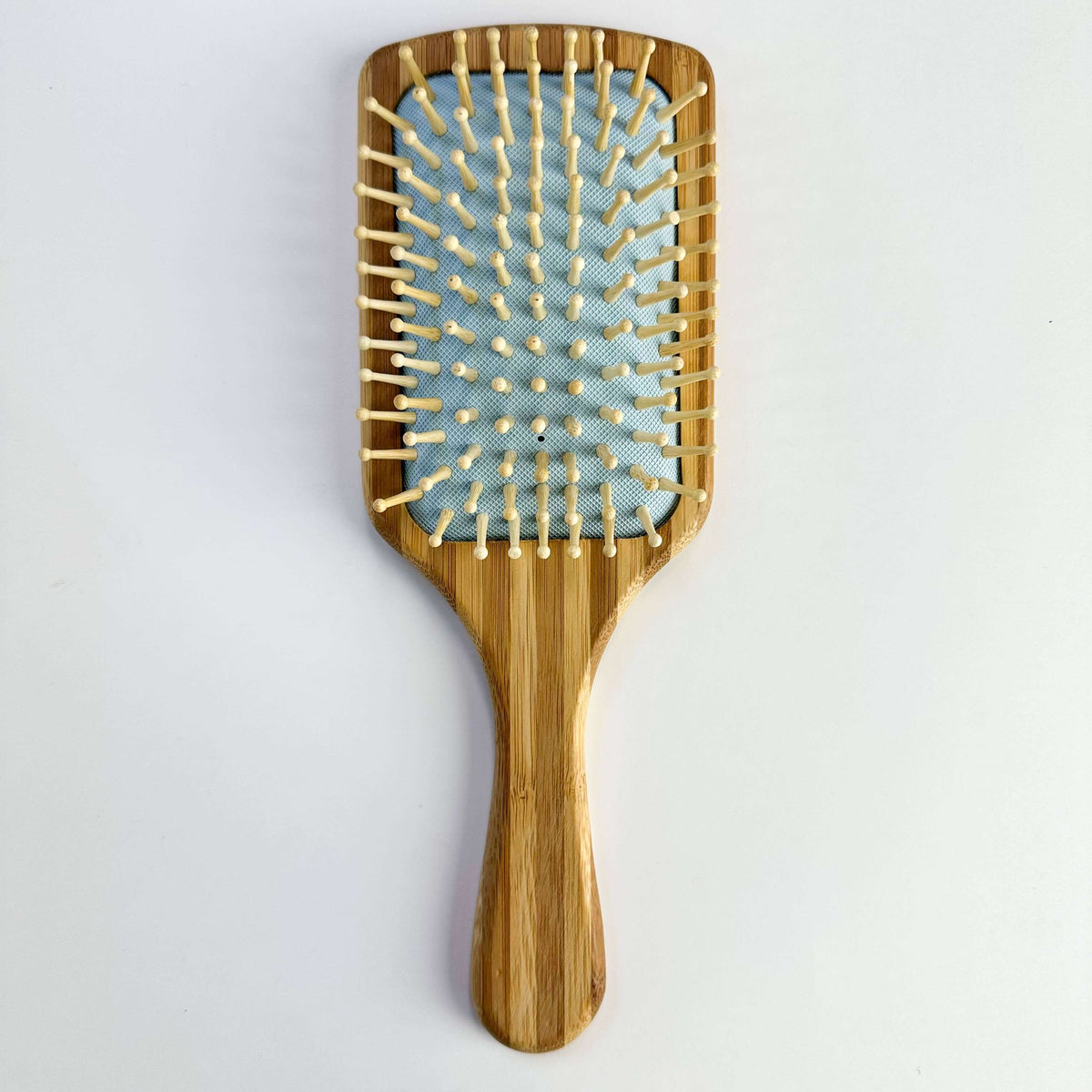 Bamboo Paddle Hair brush - Smile Boutiques with smooth bristles for gentle, sustainable haircare.