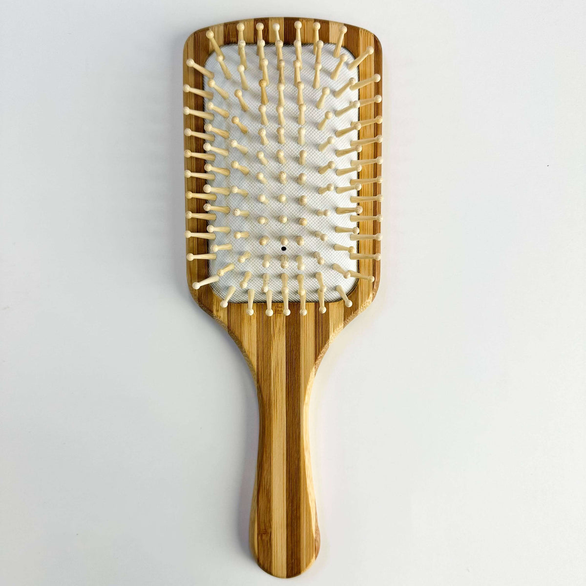 Bamboo Paddle Hair brush - Smile Boutiques for gentle, sustainable hair care with smooth bristles.