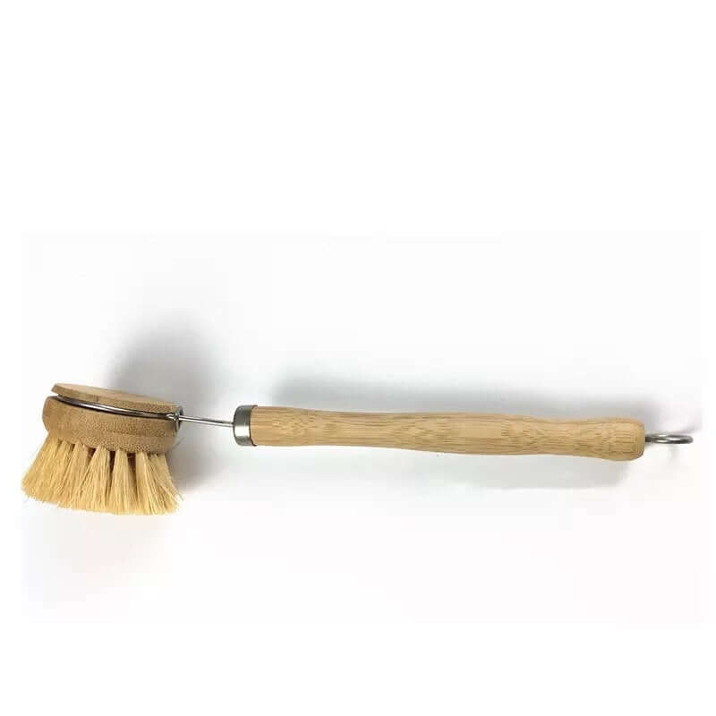 Wooden dish brush with a handle on a white background