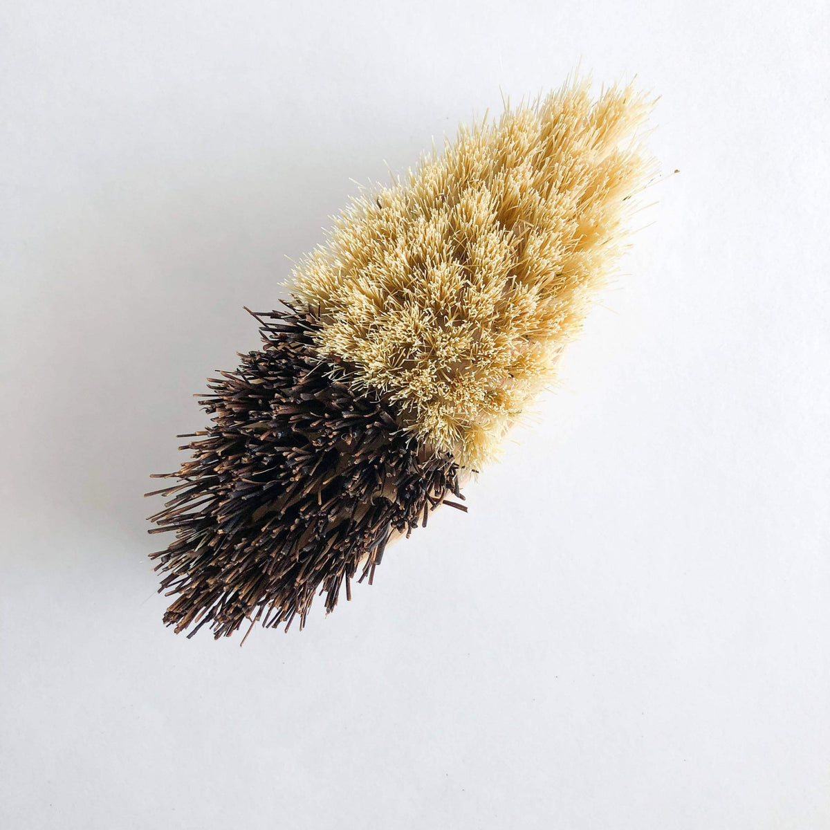 Bamboo Vegetable Brush - Smile Boutiques on a white background, showcasing its dual-bristle design for effective cleaning.