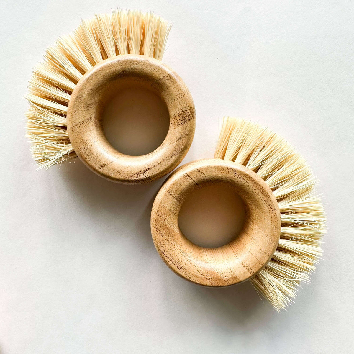 Bamboo Vegetable Brush - Smile Boutiques, eco-friendly dual-bristle cleaning brush for fruits, vegetables, and home surfaces.