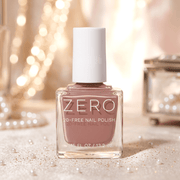 Bottle of ZERO nail polish with a soft pink color on a blurred background