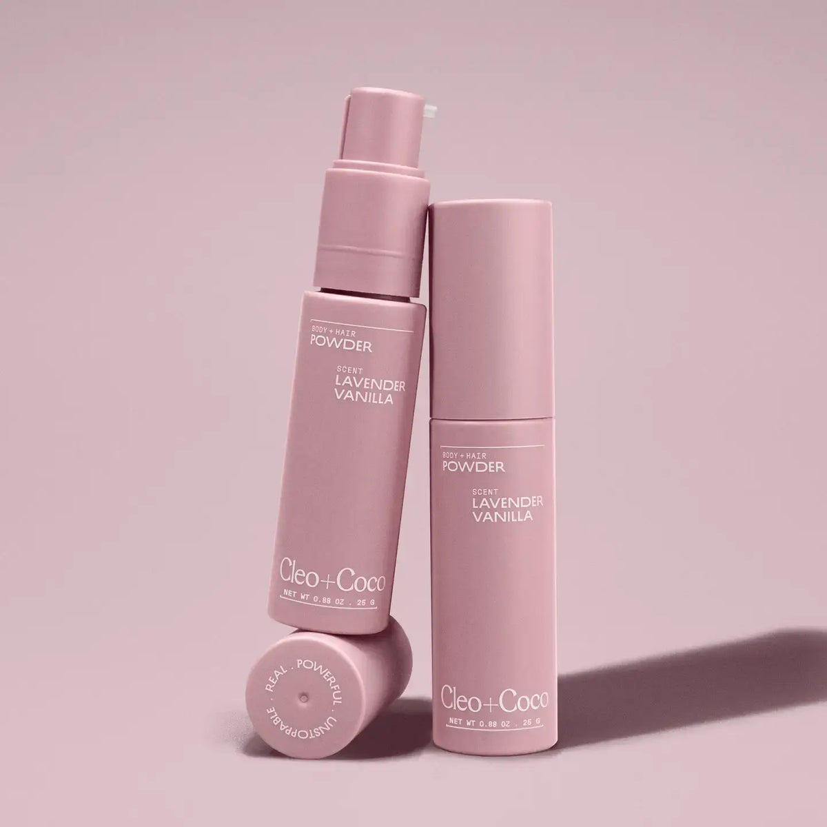 Pink skincare bottles with 'Cleo + Co.' branding on a pink background
