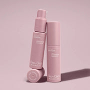 Pink skincare bottles with 'Cleo + Co.' branding on a pink background
