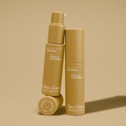 Three bottles of Cleo + CoCo body powder on a beige background
