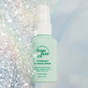 Bottle of Dope Skin Co. Antioxidant Botanical Serum on a glittery background