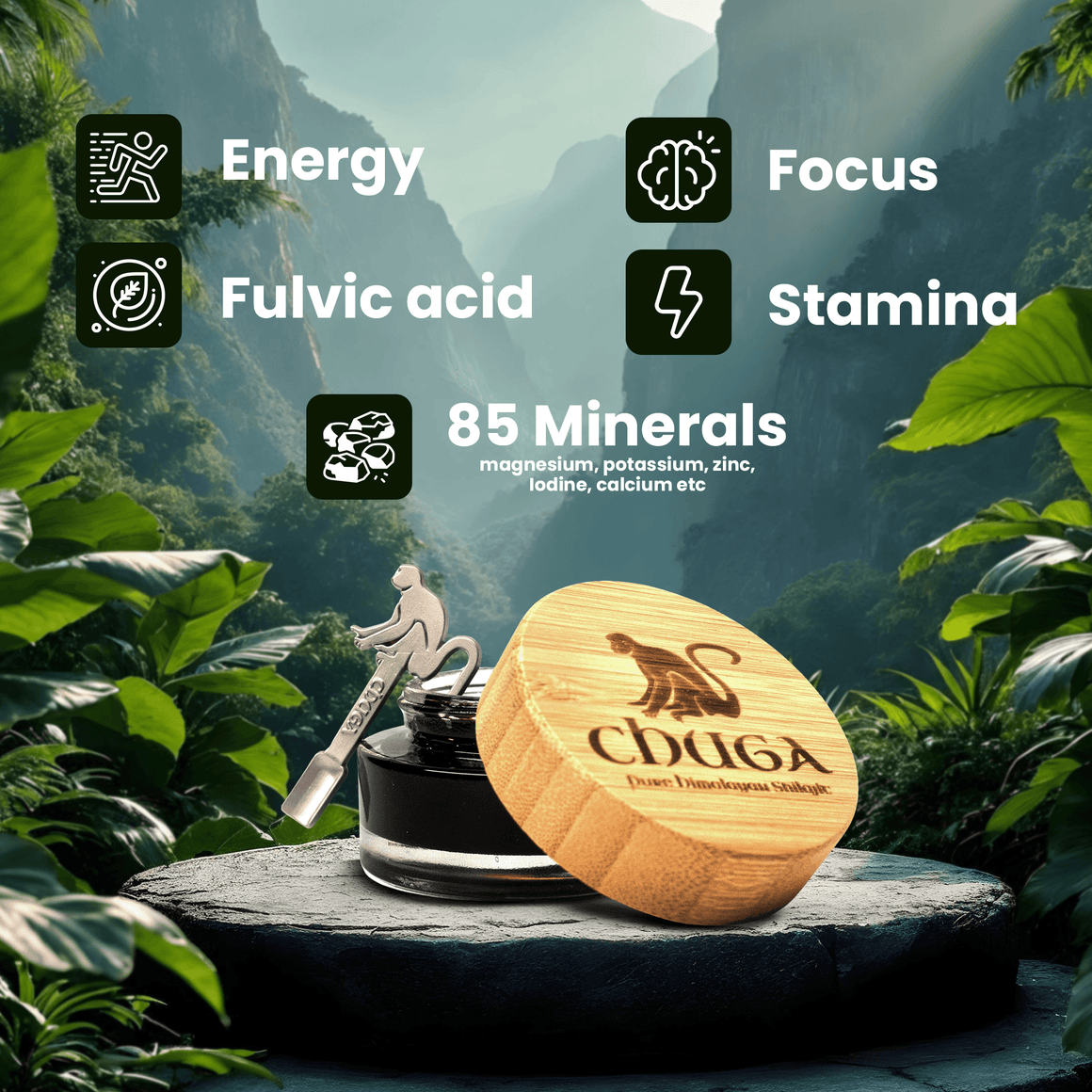 A jar of black hair oil with a light wood lid engraved with a monkey and the brand name 'CHUGA' is displayed on a stone pedestal in a lush green forest setting. Text overlays highlight key ingredients: Energy, Focus, Fulvic acid, Stamina, and 85 Minerals.
