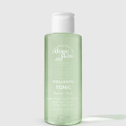 Bottle of dope skin co Collagen Tonic on a light gray background