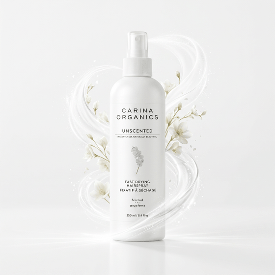 Carina Organics hair spray bottle on a white background with floral elements