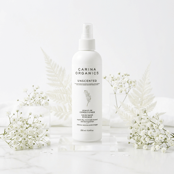 Carina Organics unscented leave-in conditioner bottle with white flowers on a light background