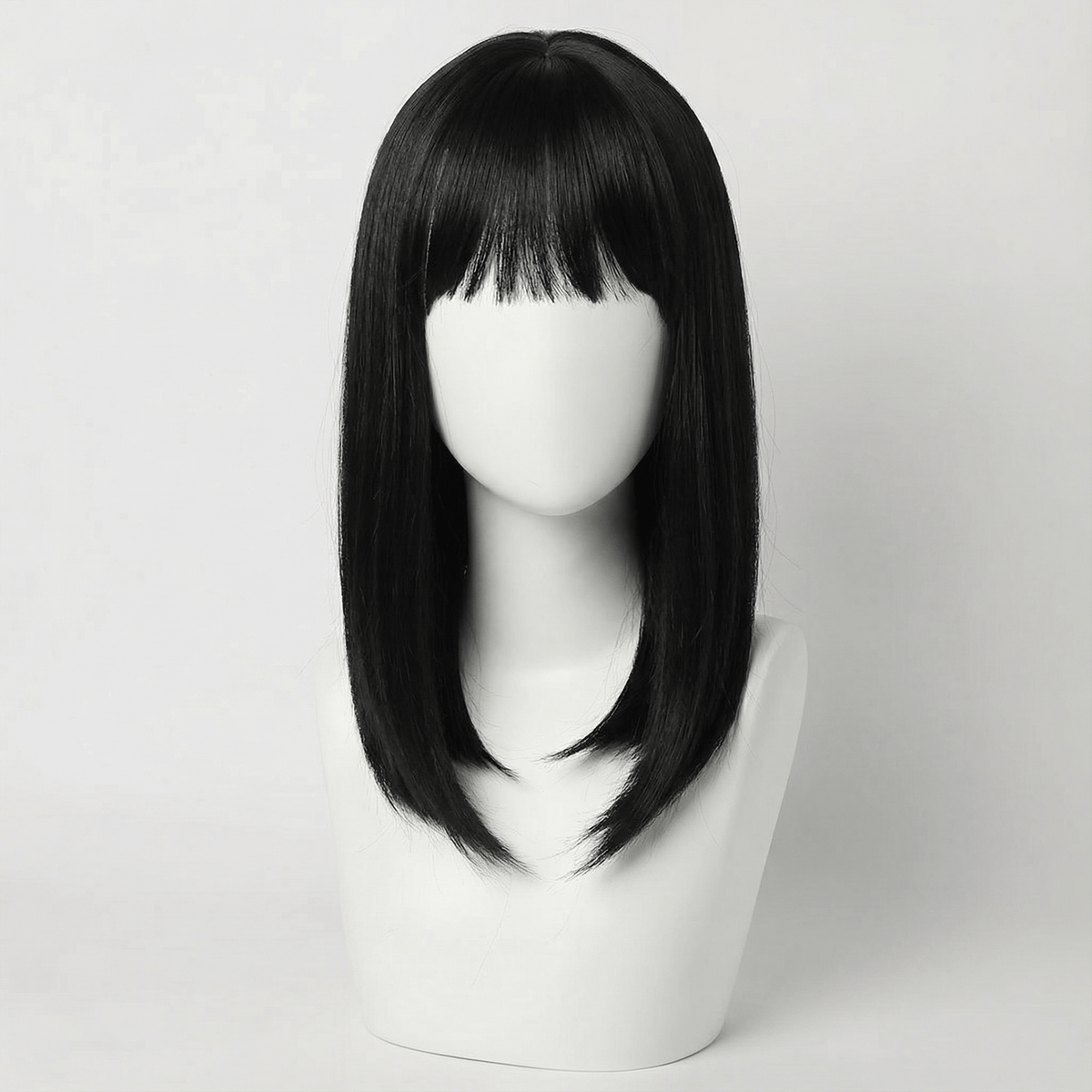 Cecil Short Black Wig with Bangs displayed on a wig stand, showcasing its sleek design and modern feathered bob.