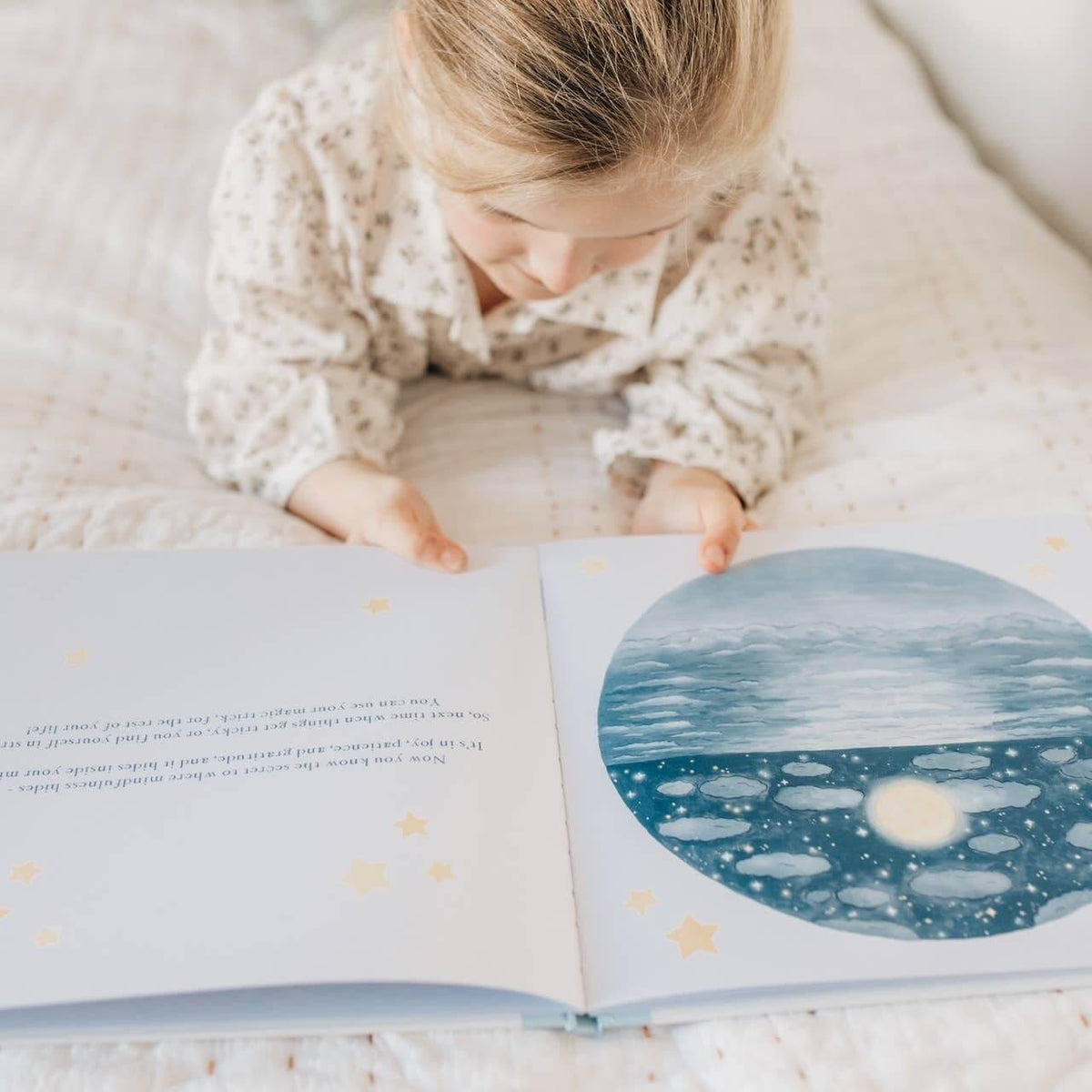 A child enjoying Charlie's Mindful Adventures By The Sea, exploring mindfulness through a beautifully illustrated book.