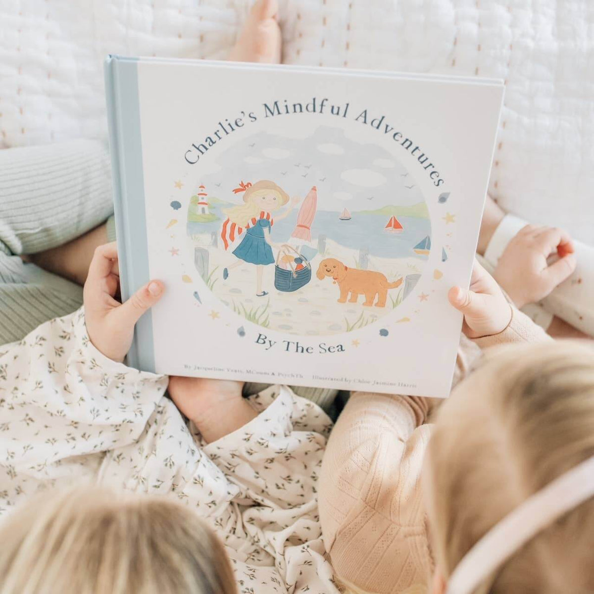 Children reading Charlie's Mindful Adventures By The Sea, a book promoting mindfulness and emotional awareness.