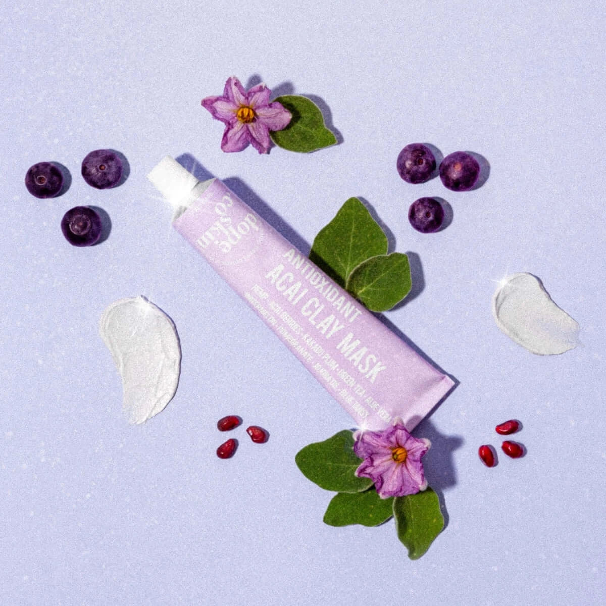 Tube of Real Clay Mask with natural elements on a light purple background