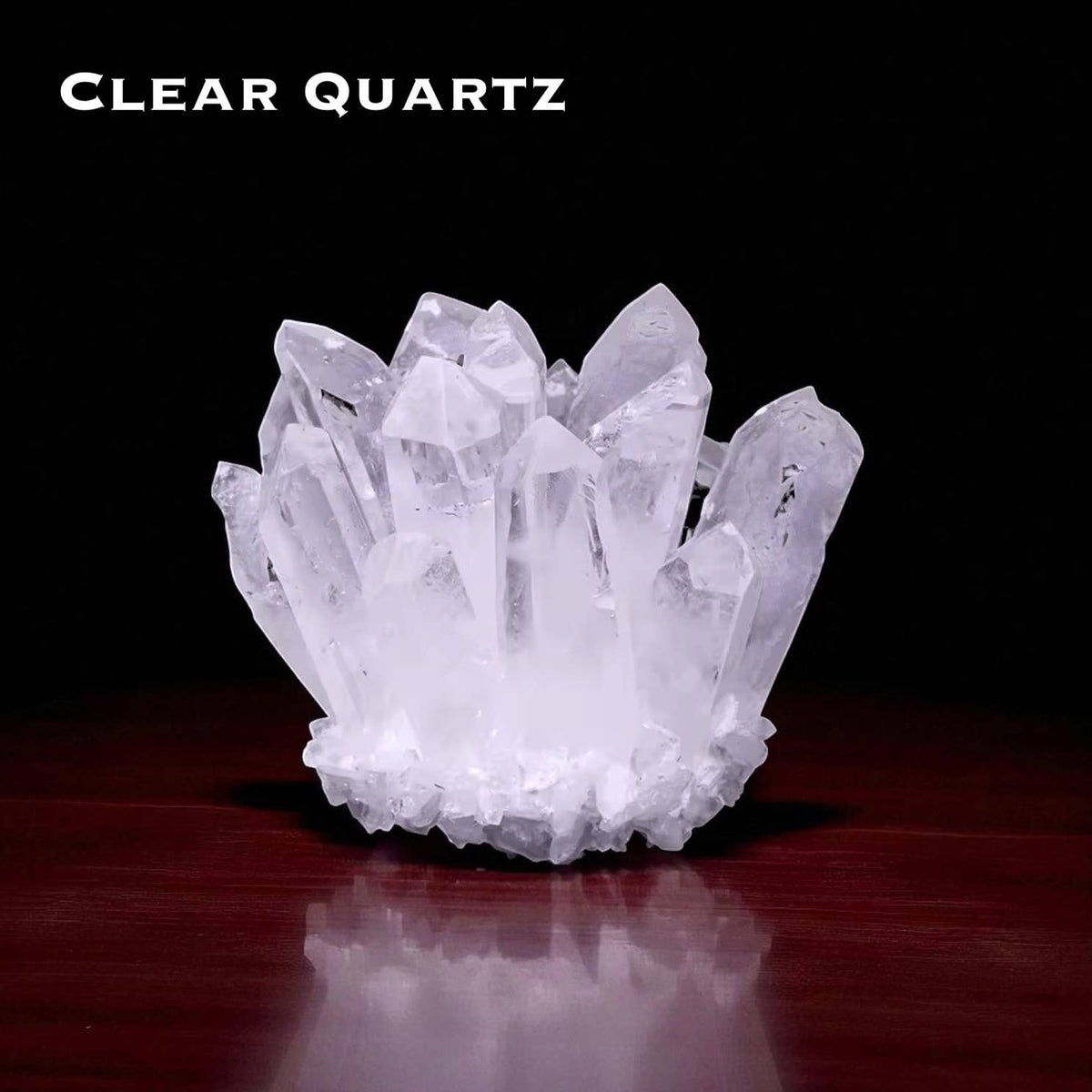 Cluster Crystal Rock Stones Display featuring a beautiful Clear Quartz crystal cluster on a wooden surface.