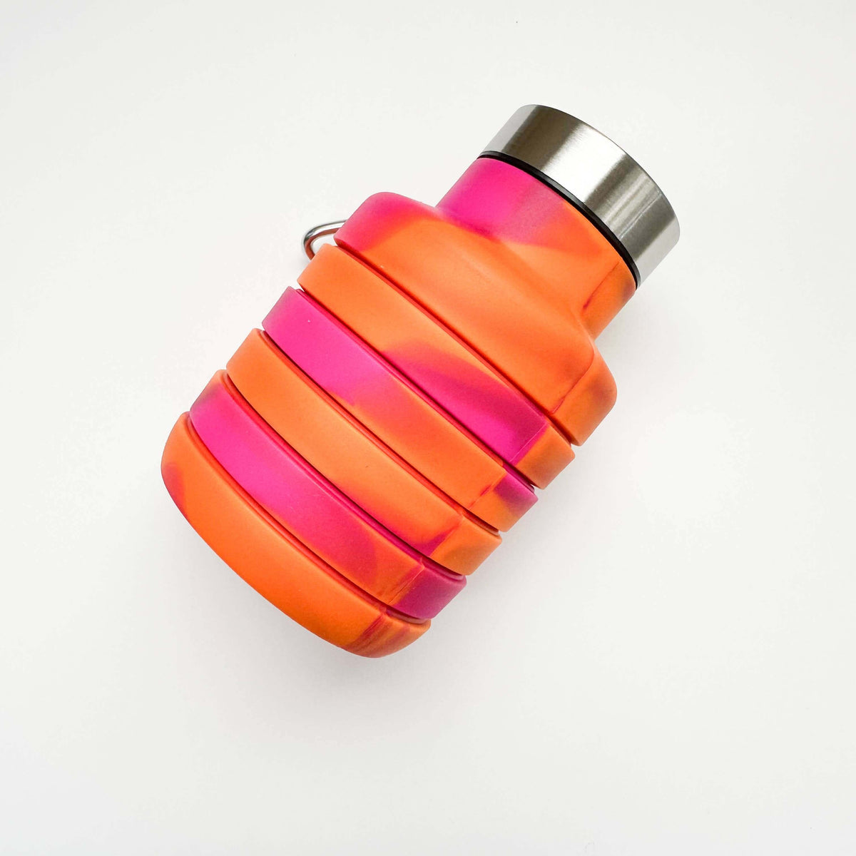 Neon pink and orange water bottle with silver cap on a white background