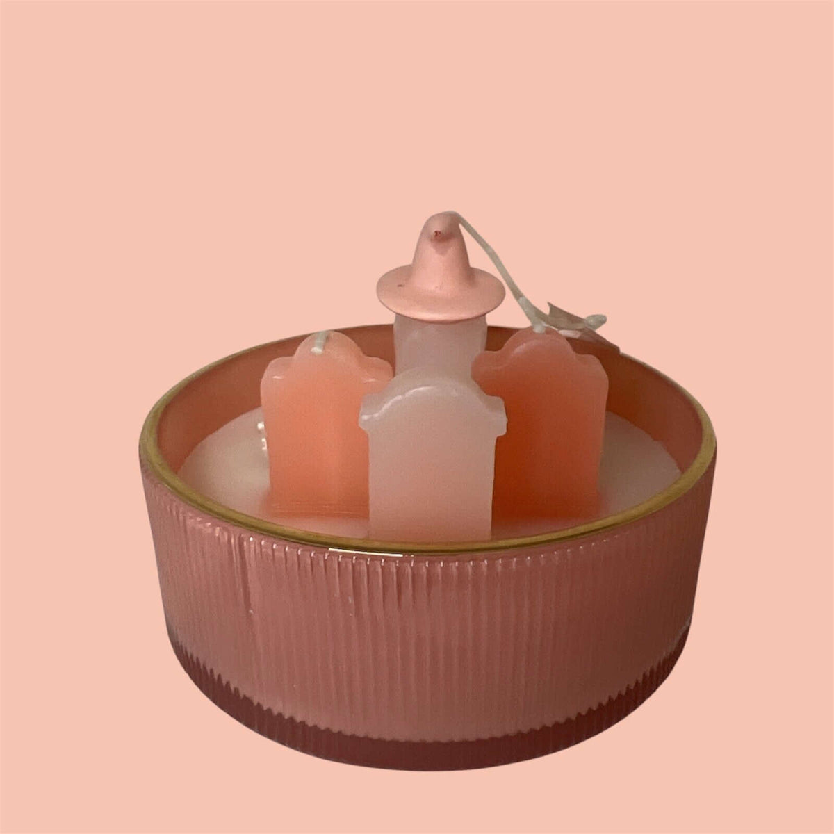 Cupcakes & Cashmere Halloween scented candle featuring playful pink tombstone design.