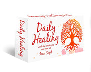 Box of 'Daily Healing' cards with a tree design on a white background