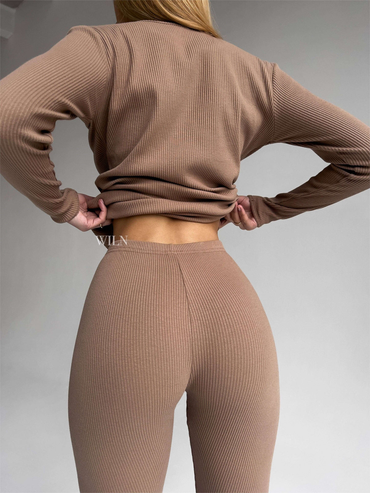 EASE 2 Piece Ribbed Cotton Loungewear Set - Biscuit shown from behind, highlighting the soft ribbed fabric and fitted design.
