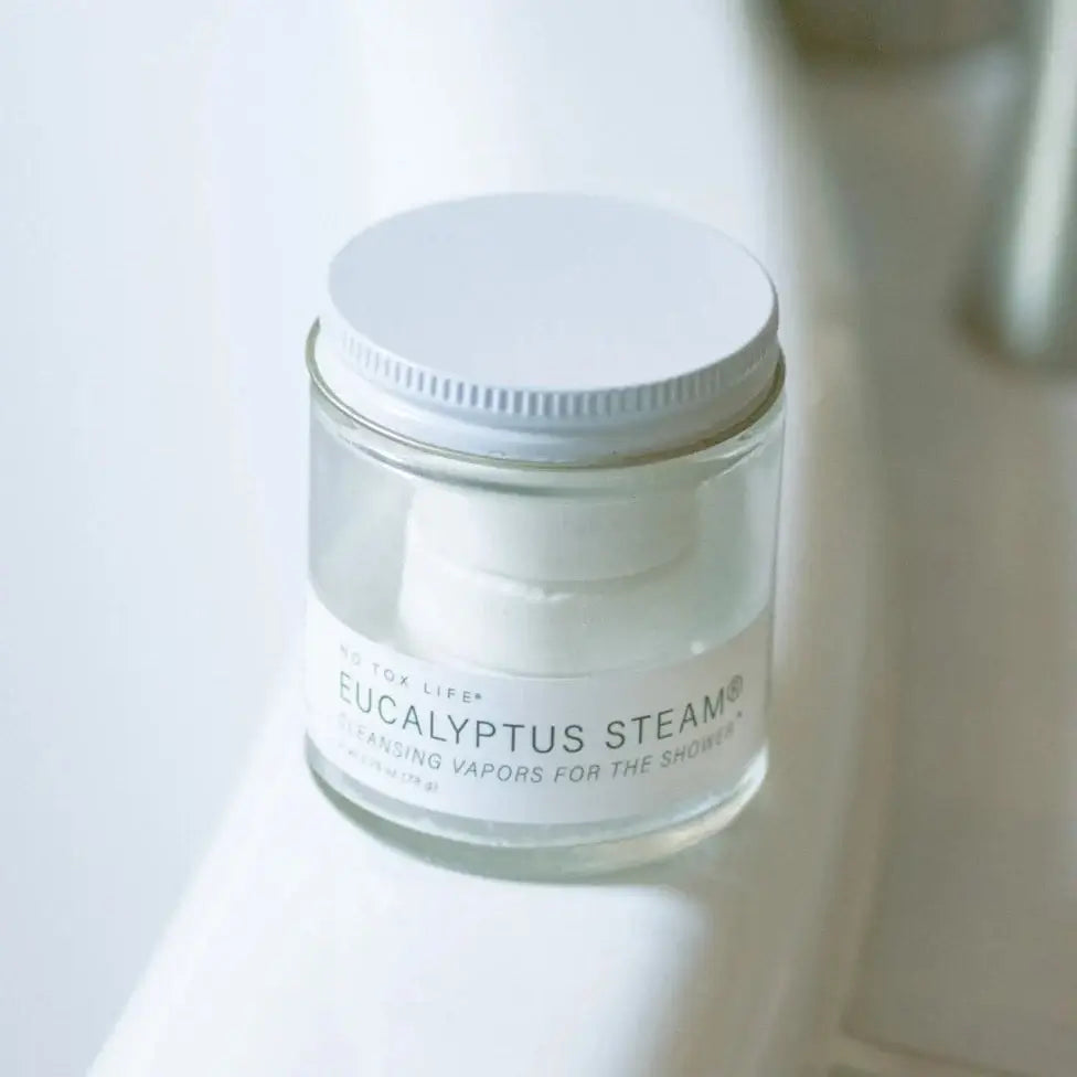 Jar of Eucalyptus Steam product on a white surface