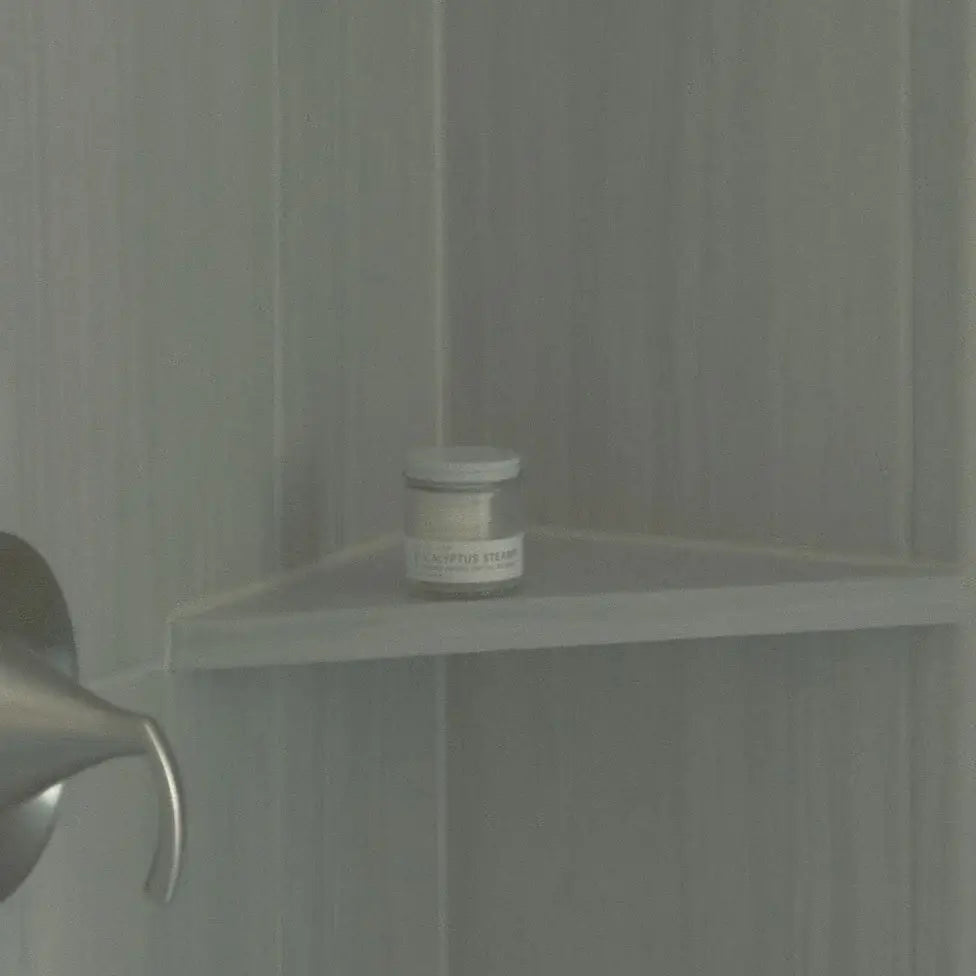Small jar on a shelf in a bathroom setting