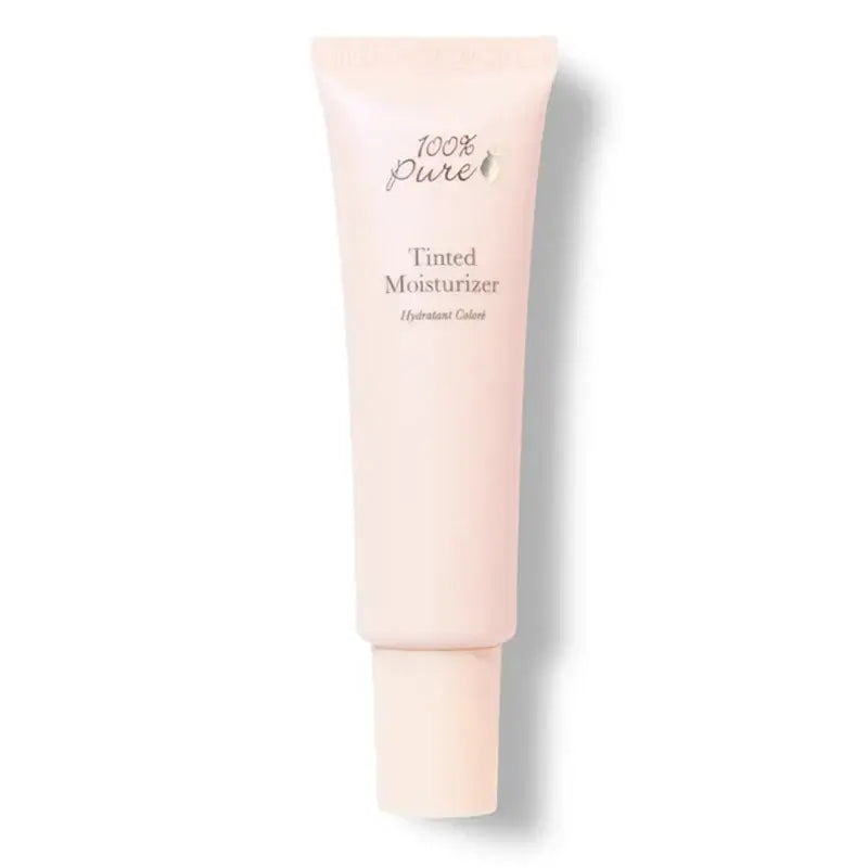 Pink tube of 100% Pure Tinted Moisturizer on a white background