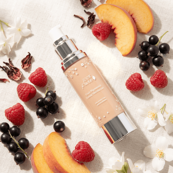 Fruit Pigmented® Tinted Moisturizer - 100% Pure 50 ml with fruits on a light background.