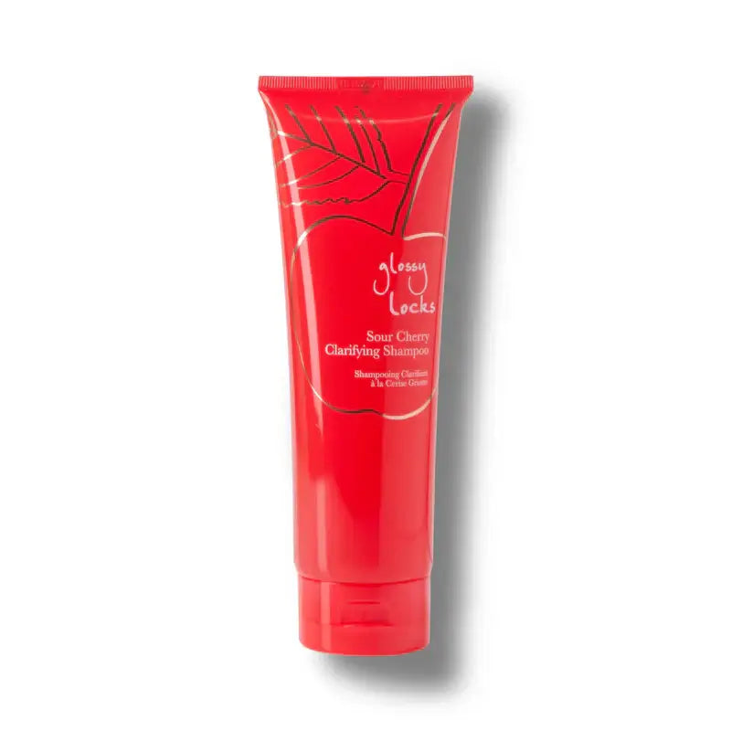 Red shampoo tube with 'Glossy Locks' branding on a white background