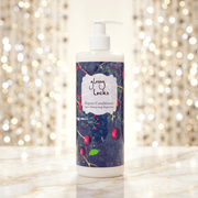 Glossy Locks repair conditioner bottle with a decorative label on a sparkling background