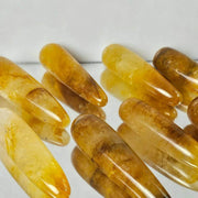 Amber-colored beads on a white background